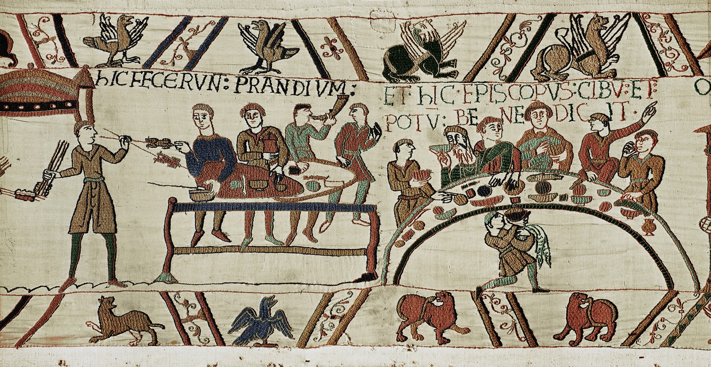 Figure 10-1: The scene from the Bayeux Tapestry depicts the feast before the battle.